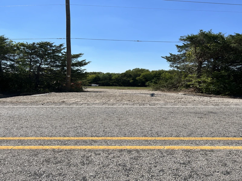 Gravel driveway or parking area being resurfaced and improved