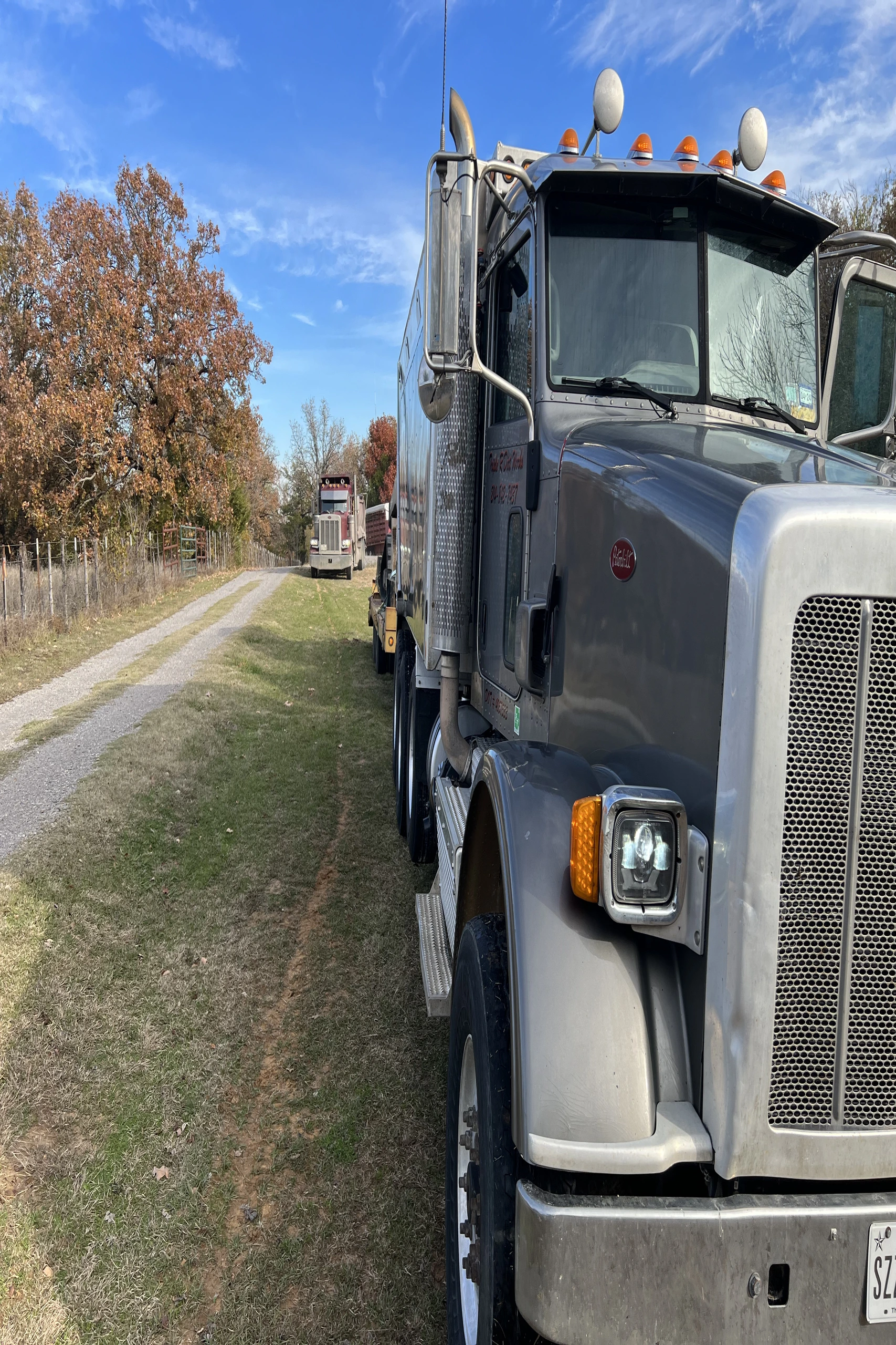 Dump truck delivering aggregate material to a jobsite